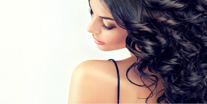 Beautiful girl model with long black curled hair
