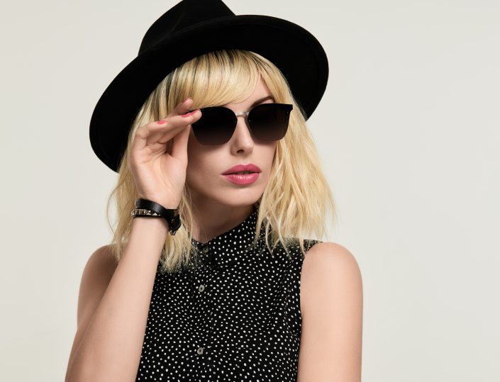 Blonde girl in Elegant Dress and Trendy Sunglasses