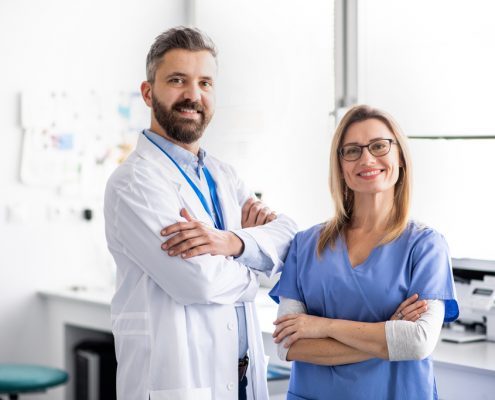 A,Dentist,With,Dental,Assistant,In,Modern,Dental,Surgery.